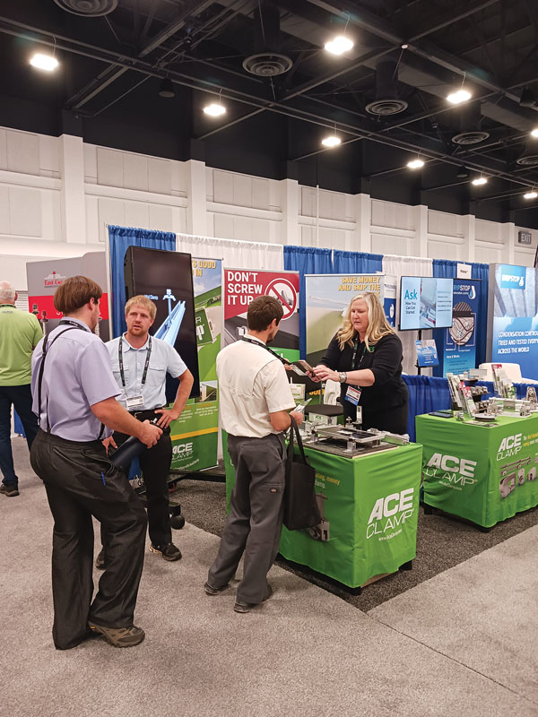 MJ Wasley scans a visitor’s badge. Shield Wall Media provides exhibitors with all the guest registration information after the show