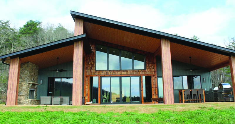 This home showcases EDCO board and batten siding in Willow, accented with Craftsman Plank in Tiger Wood underneath, creating a clean, elevated look with rich contrast.